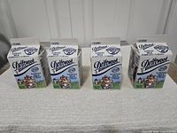 Front view showing all four cartons with Driftwood branding