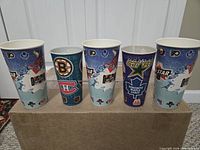 Five NHL map series cups with team logos
