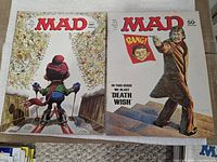 Two 1970s MAD magazines, 50¢ covers showing skiing scene and Death Wish parody