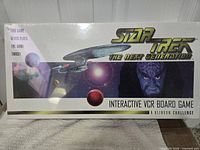 Front of sealed game box showing title and graphics