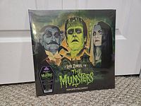 Front cover of The Munsters sealed vinyl LP showing artwork and shrink wrap