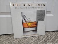 Front of The Gentlemen soundtrack sealed LP showing cover art and hype sticker