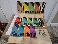 Array of colourful TV Times pamphlets, front covers visible