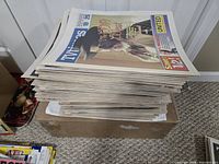 Stack of TV Times supplements on box