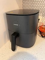 Front view of Cosori Pro LE air fryer on countertop