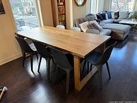 Table with six chairs on one side shown from front left