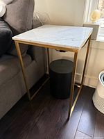 Side table overall view next to sofa