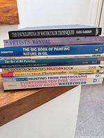 Stack of nine art instruction books, spines visible