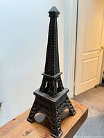 Full view of assembled cast iron Eiffel Tower candle holder