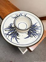 Top view of round platter with attached dip bowl showing full design