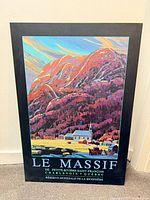 Front view of mounted Le Massif poster showing full artwork and text