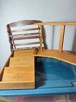 All three wood items together: spice rack, bamboo drawer insert, pine shelf