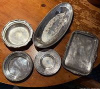 All five silver-plated trays displayed together