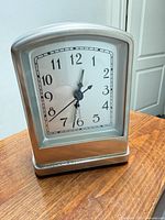 Front view showing clock face, shape and finish