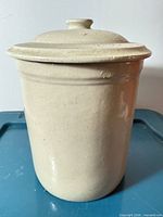 Full view of stoneware pickling pot with lid in place