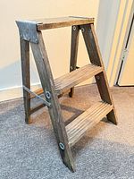 Full view of wood two-step folding stool