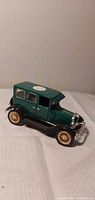 Left front view of green die-cast 1926 Ford model car