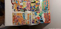 All four Archie comics laid out showing full covers