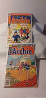 Front covers of both Archie comic books