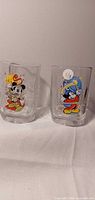 Both Mickey Mouse glasses side by side