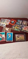 Group shot of approx 12 NFL trading cards spread on surface