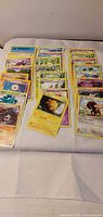 All 24 Pokémon cards spread in three rows