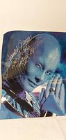 Full view of signed 8x10 photo showing alien character and autograph