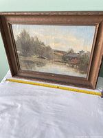 Front view of framed painting with measuring tape