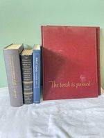 Front view showing all five hardcovers standing