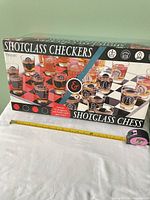 Retail box front displaying Shotglass Checkers & Shotglass Chess branding