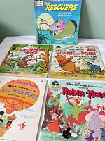 Cover view of eight Disney read-along books