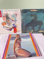 Front covers of three Beach Boys vinyl albums