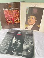 Front covers of all three vinyl albums
