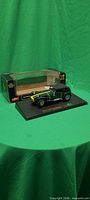 Model car on plinth with box behind