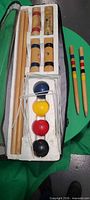 Full set in carry case with mallets, balls, wickets visible plus two goal stakes