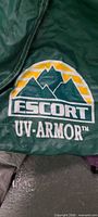 Close view of Escort UV Armor logo on tent fabric