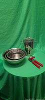 All items together: steamer pot, nested bowls, can opener