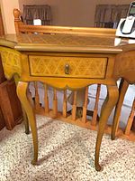 Front view of narrow hall table showing drawer, cabriole legs, inlay