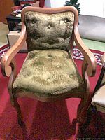 Front view of green velvet tufted chair