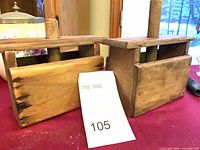 Both wooden butter presses side by side, front view