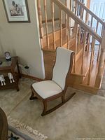 Full view of rocking chair at staircase