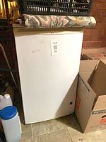 Front exterior of white LG mini fridge