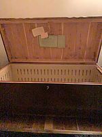 Lid open showing cedar interior and labels