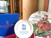 Overall view showing both plates and Royal Doulton box