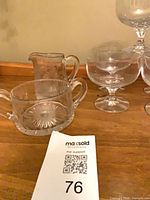 Cream pitcher, sugar bowl and dessert coupes grouped