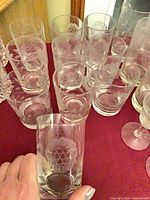 Etched floral tumblers displayed on tabletop