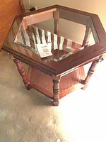 Overall view of hexagon table showing glass top and legs