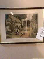 Rectangular framed cottage scene print with figures and ducks