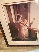 Framed print showing girls with violin, wide view