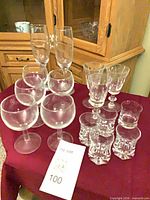 Group view of all stemware and shot glasses on table